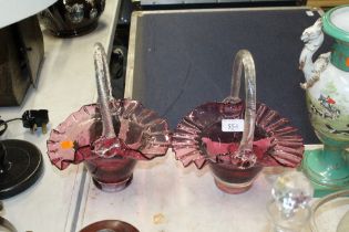 A pair of Cranberry glass baskets