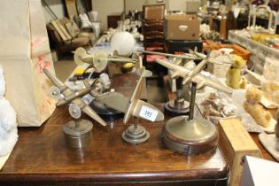 Five period cast brass models of various WWII aeroplanes