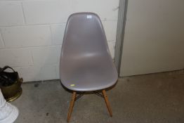 A Vitra Eames grey plastic chair