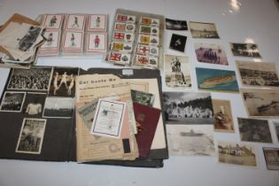 A collection of military ephemera including photos