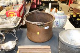 A copper swing handled cauldron