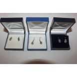 Three pairs of 9ct gold ear-rings set with coloure