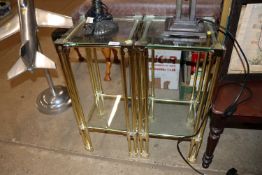 Two brass and glass two tier stands