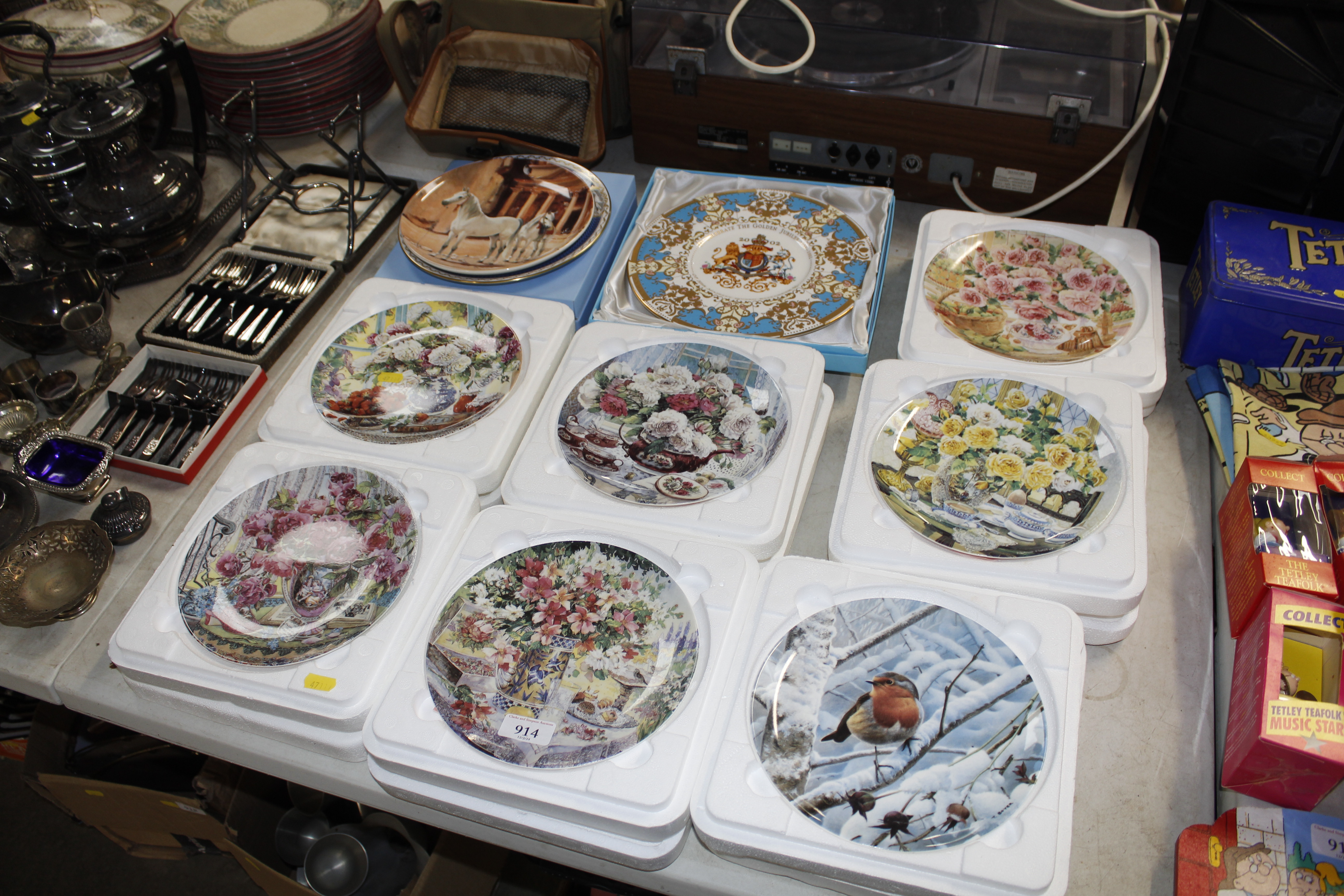 A collection of various collectors plates