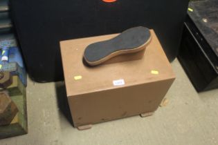 A shoe shiners stand with internal drawer containi