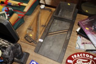 A vintage oak bread slicer and a Crescent vintage