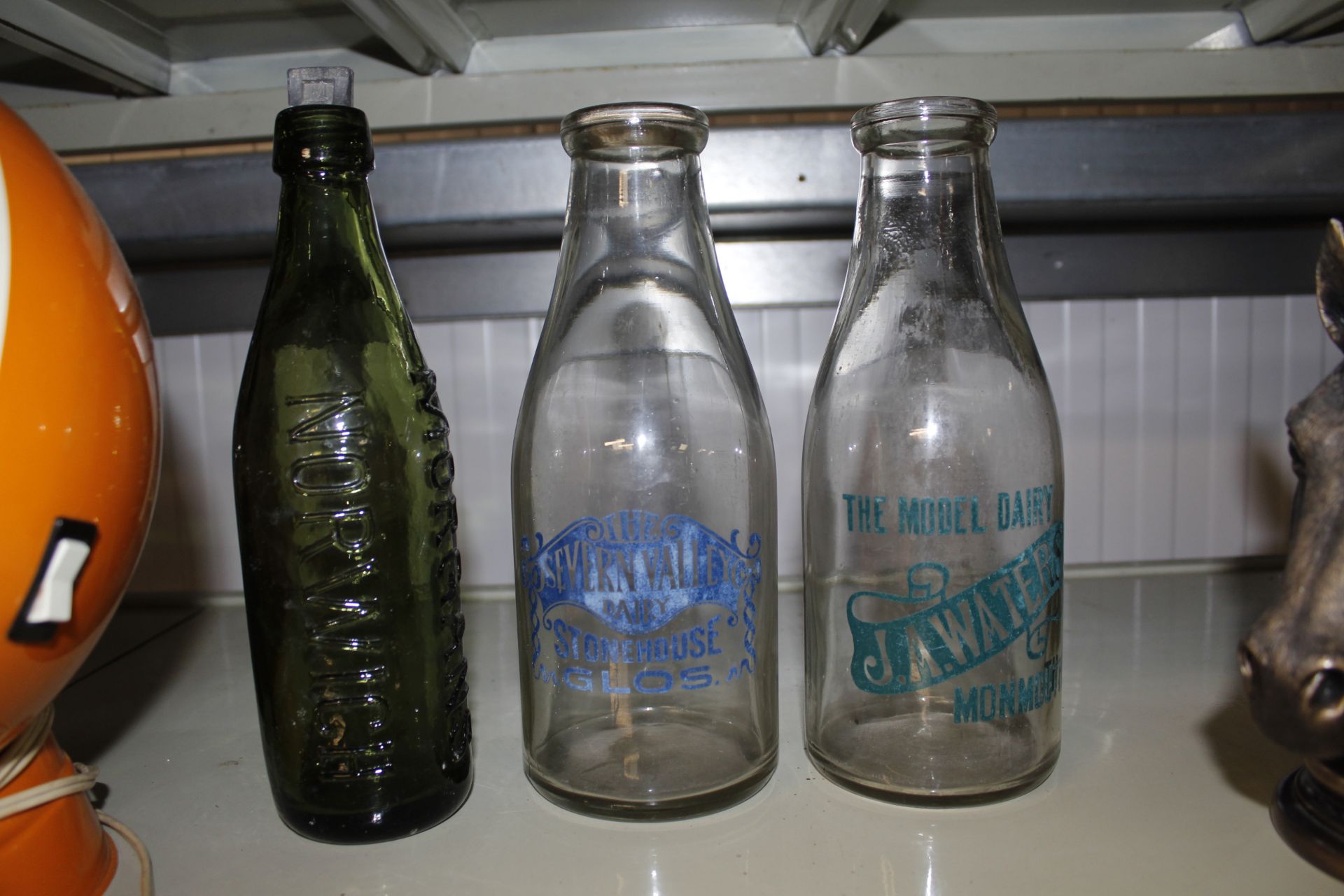 Three old bottles, two decorated milk bottles and - Image 2 of 2