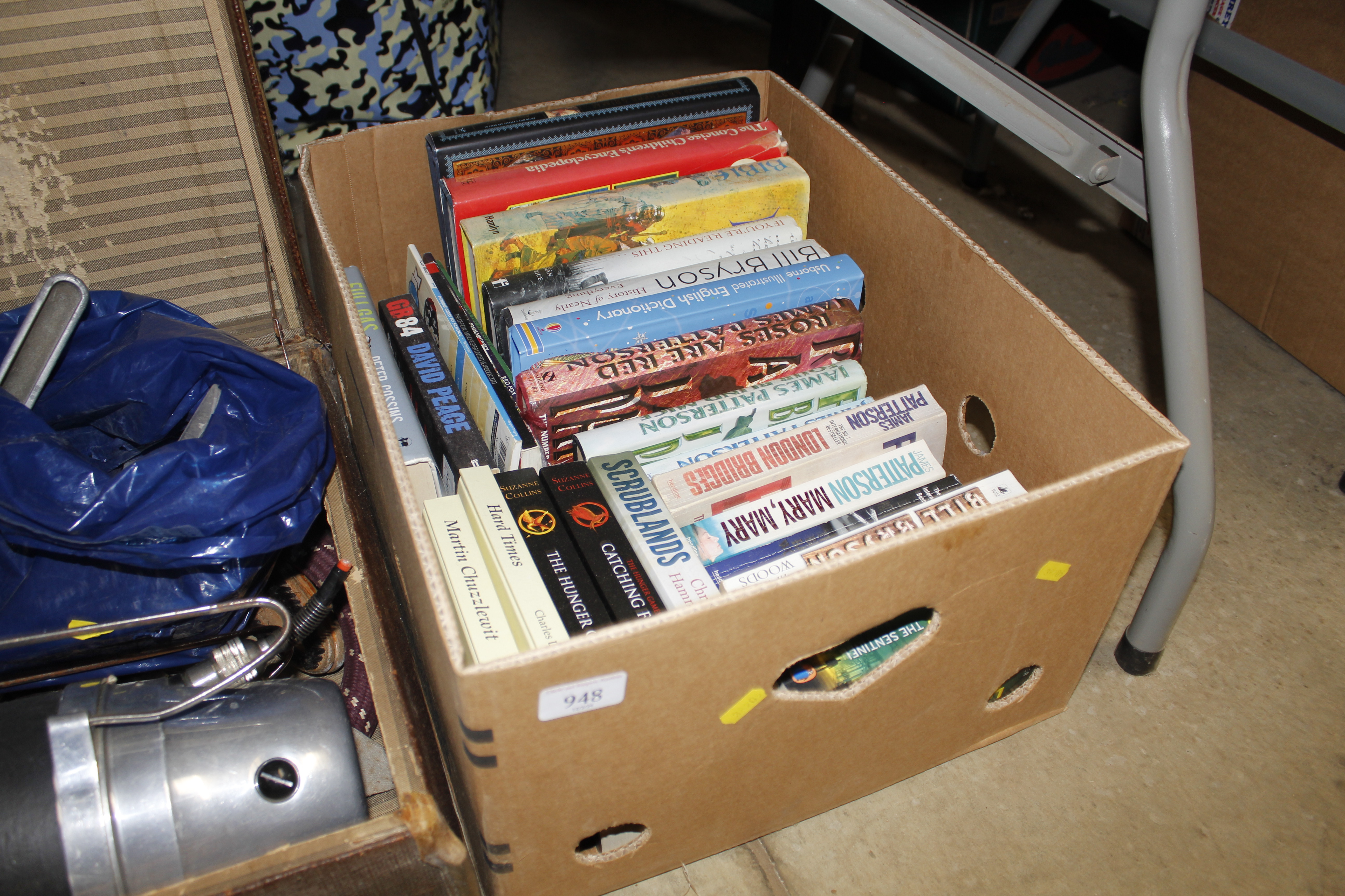 A box of miscellaneous paperback books