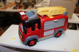 A Toy fire engine with lights and siren