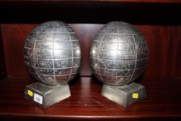 A pair of metal ware globe book ends