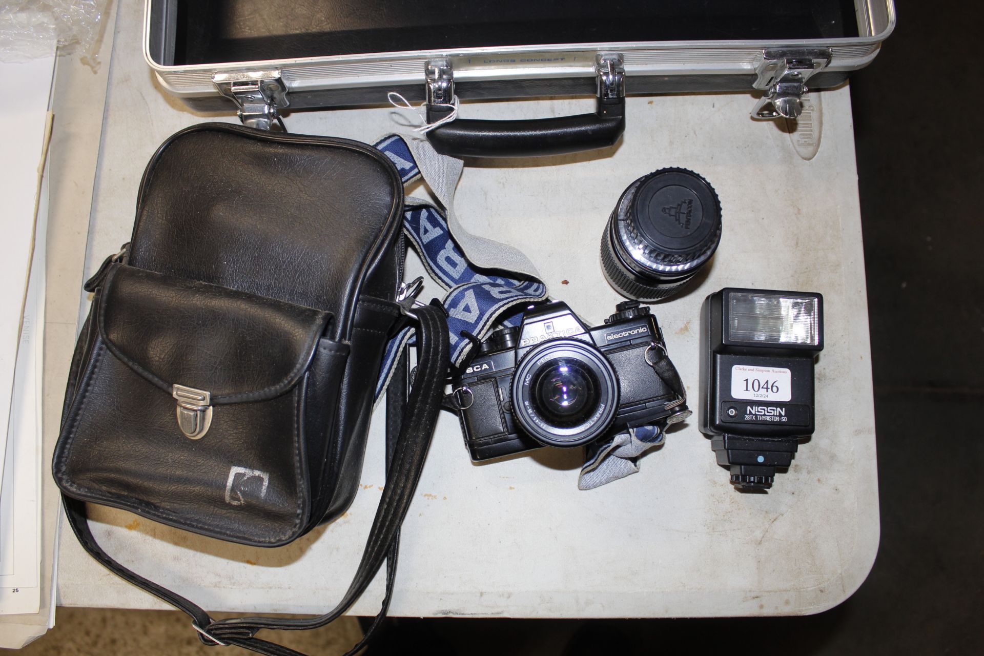 A Praktica camera, carrying case, a lens, flash un - Image 2 of 2