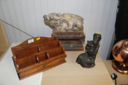 A carved figure group of mother and child, a hardwood stationery rack and an Eastern box with