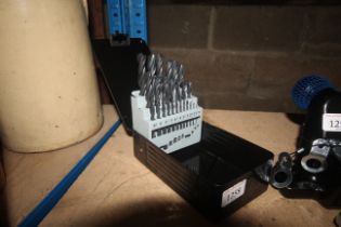 A twenty five piece drill set in fitted metal case