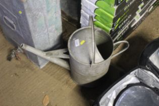 A galvanised 2.5 gallon watering can