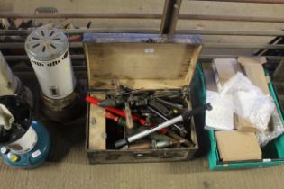 A wooden and metal bound chest containing various