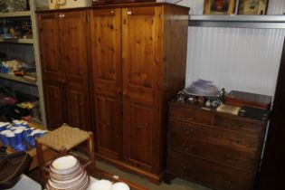 A modern pine two door wardrobe