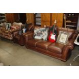 A leather three seater settee and matching armchair