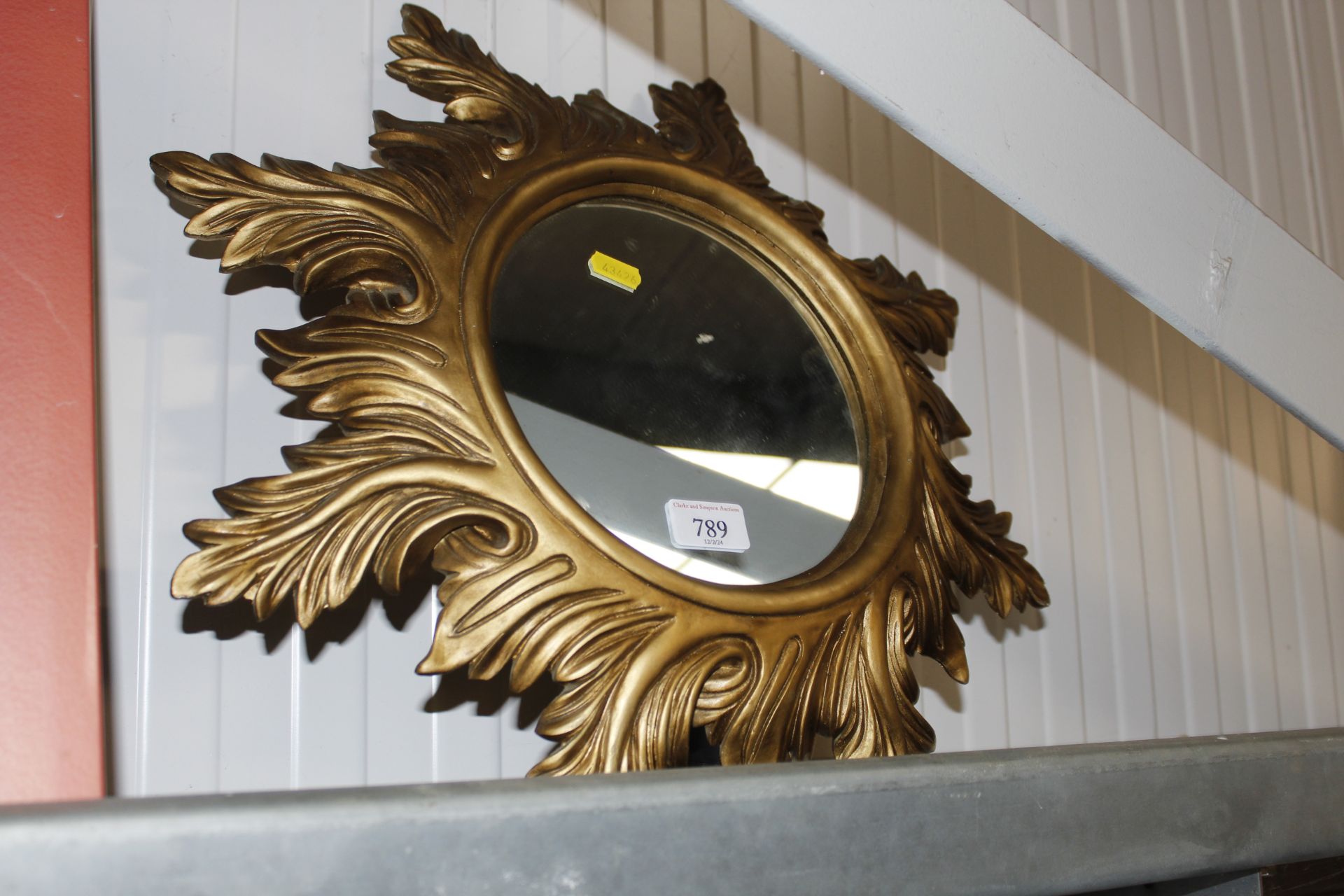 A circular Florentine style gilt wall mirror