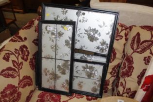 A collection of mirrored decorative frames