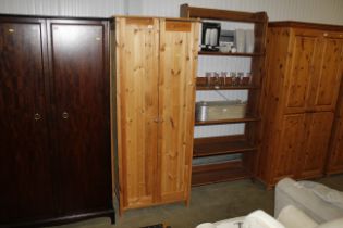 A modern pine hanging wardrobe