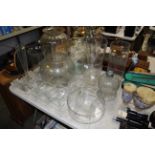 A quantity of various large glass vases, bowls etc