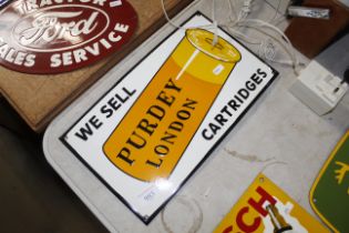 A reproduction Purdy Cartridges advertising sign