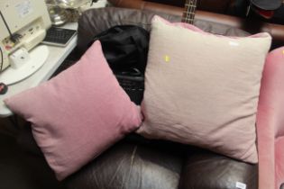 A pair of designers guild cushions