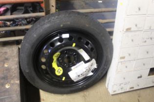A Space Saver wheel and tyre Continental T125/80R1
