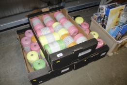 Three boxes of various coloured yarn rolls