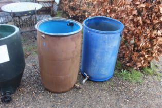 Two plastic containers converted to water butts (l