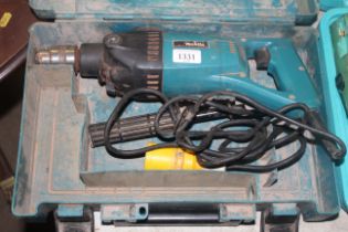 A Makita 8406 110v drill in fitted plastic case