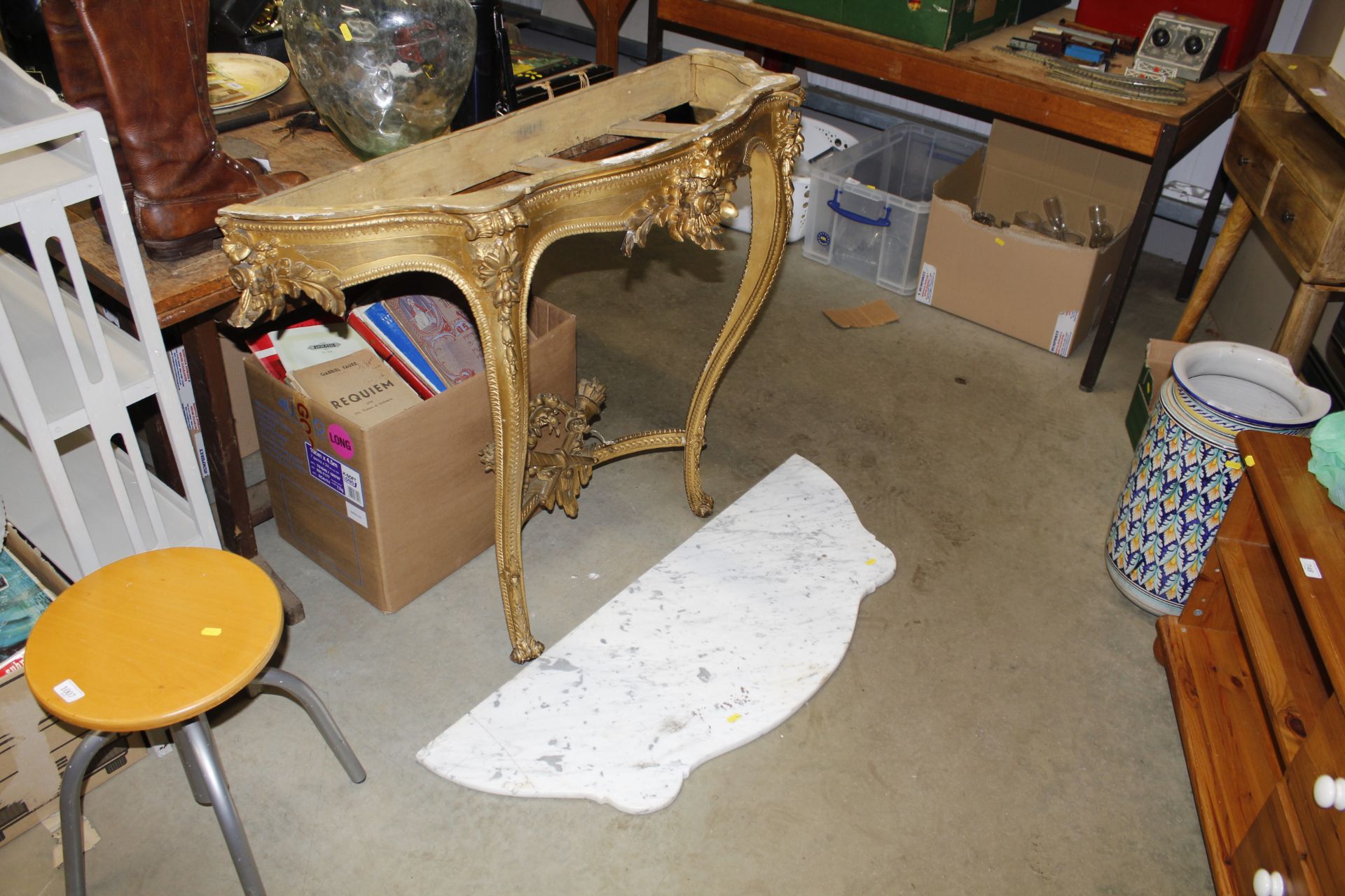 An antique French console table with marble top