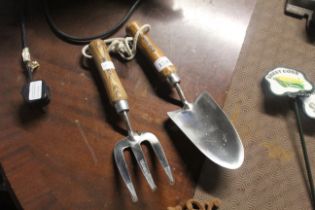 A stainless steel hand trowel and fork (11)