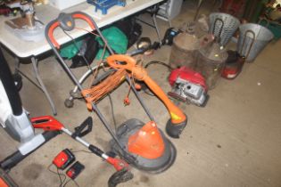 A Husqvarna HV2800 electric hover mower together w