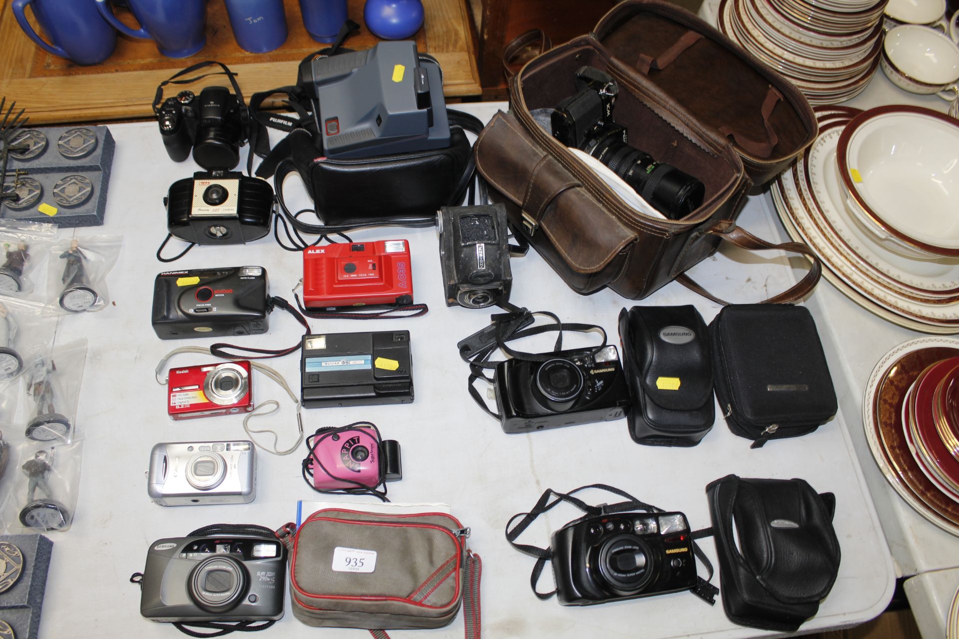 A collection of various cameras including Pentax,