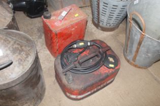 A metal two gallon fuel can with lid, together wit