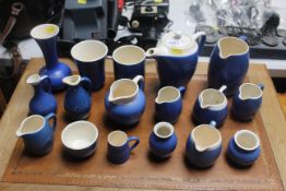 A quantity of Cornish jugs, tea pot and vase