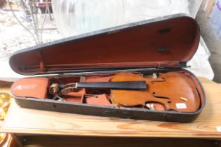 A violin in fitted case AF