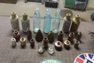 Three vintage glass bottles together with a quanti