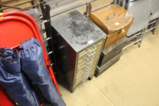 A small metal ten drawer filing cabinet