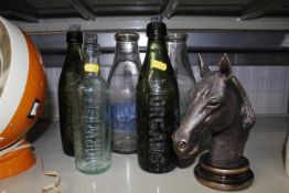 Three old bottles, two decorated milk bottles and