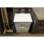 A white painted wooden set of three drawers