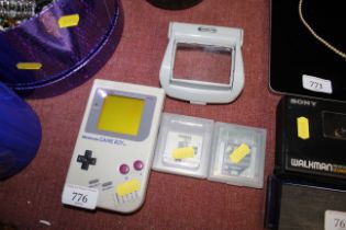 A Gameboy with games and accessories