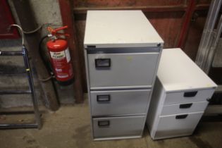 A Triumph metal three drawer filing cabinet with k