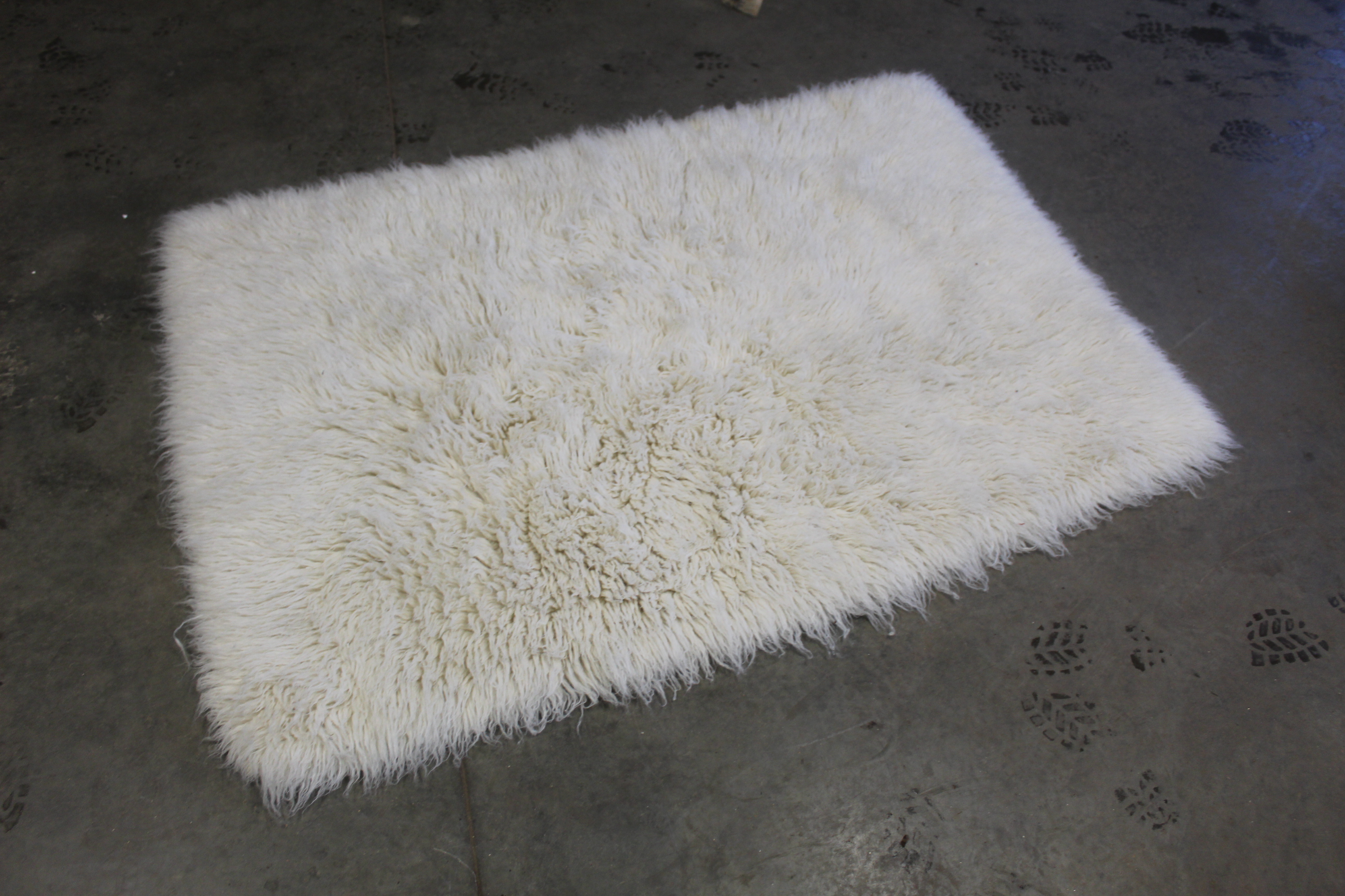 An approx. 6" x 4'1" wool rug