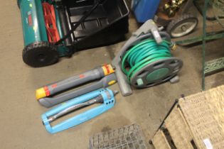 A Hozelock hose reel and length of hose together w