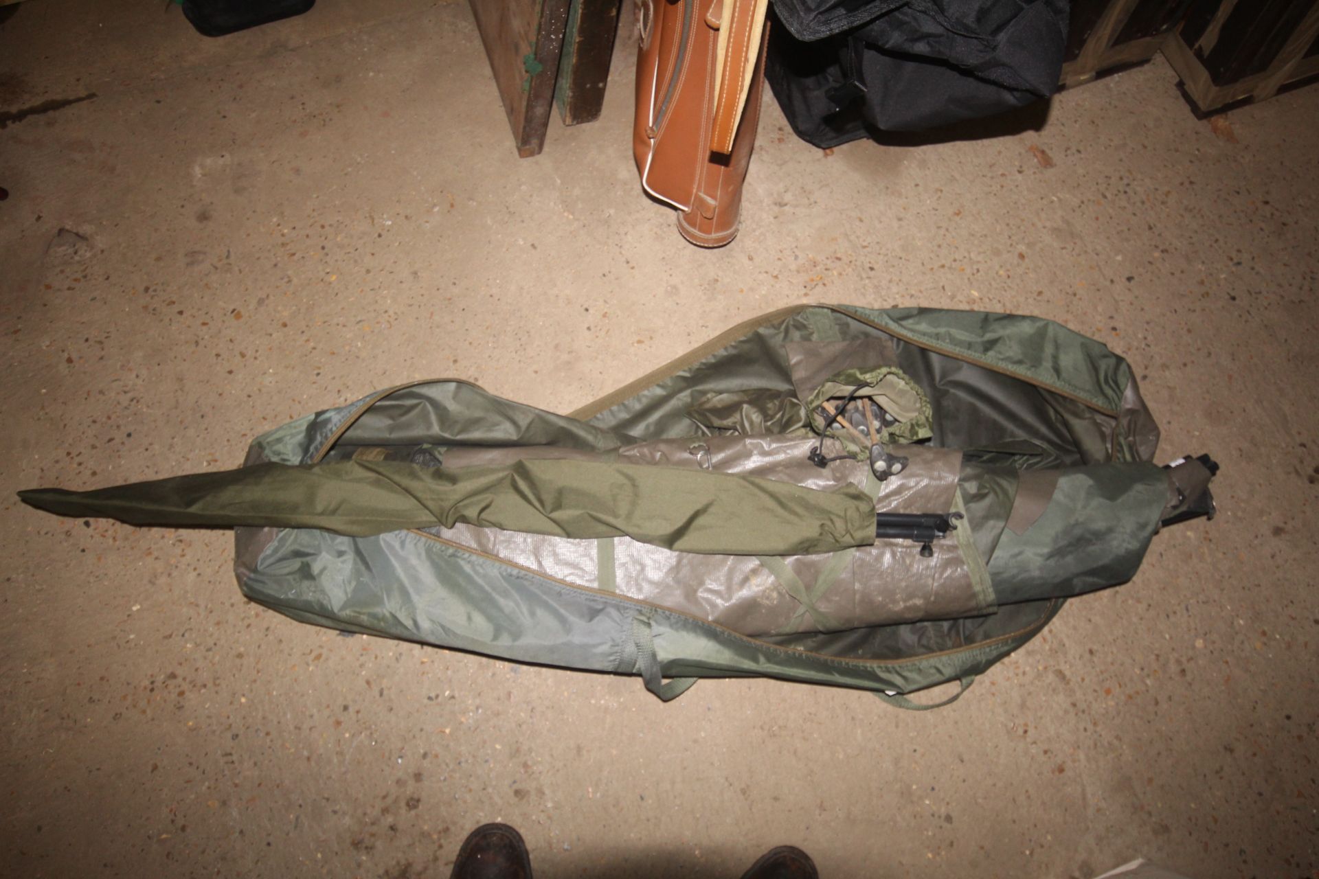 A Trakker fishing bivvy (one man, pram hood)