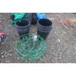 A quantity of plastic plant pots and hanging plant