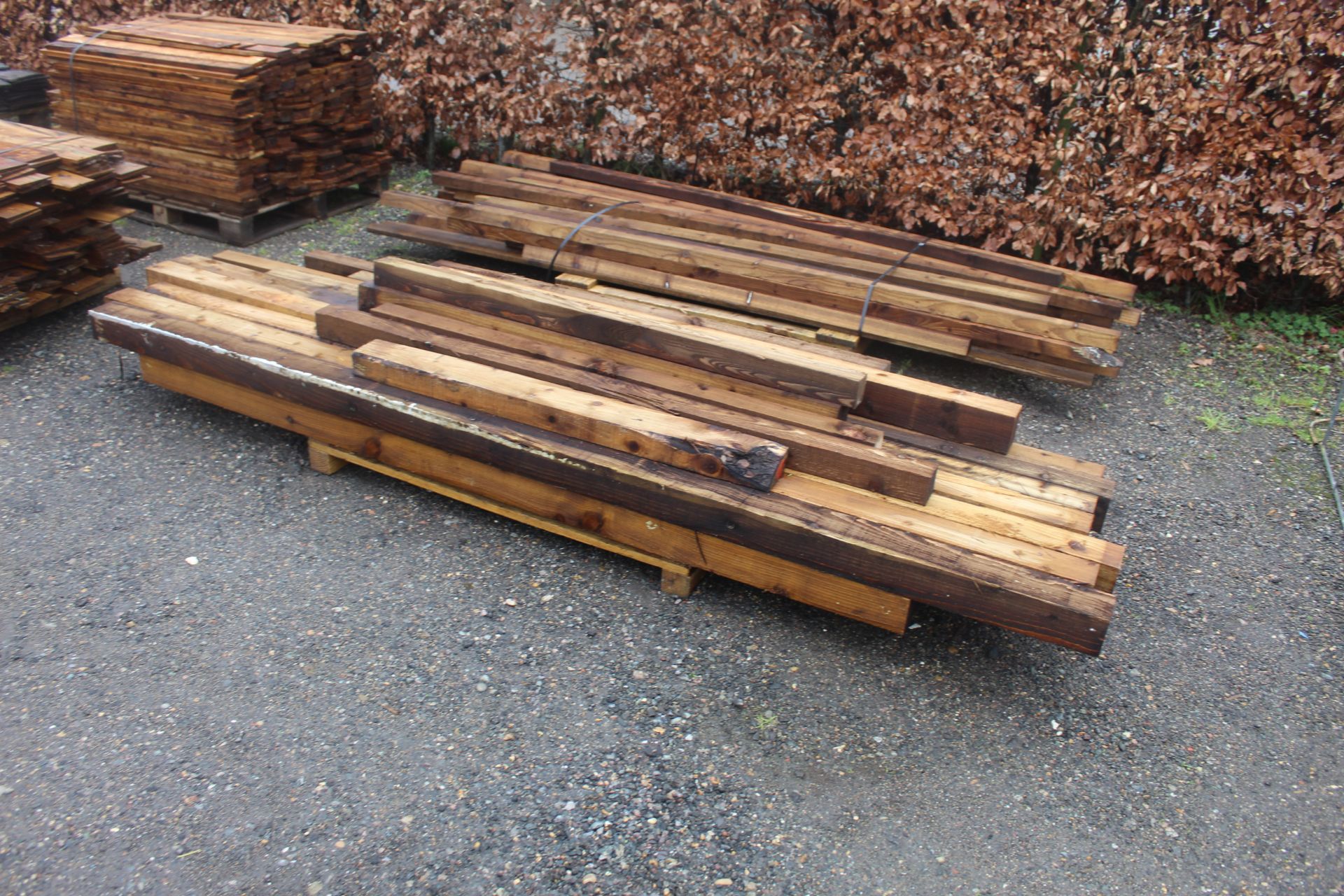 A quantity of various 3" and 4" cut timber posts e