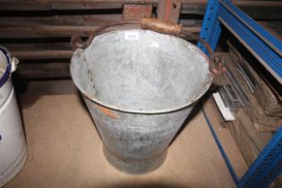 A galvanised pail with metal swing handle (148)